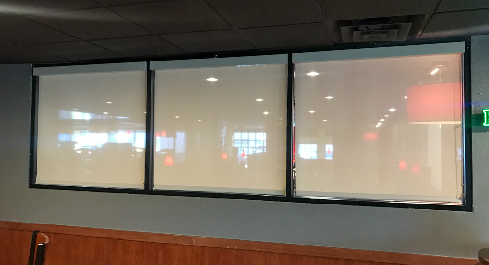 Window shade in a commercial property for privacy purposes