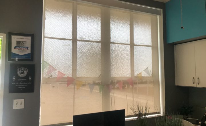 Rolled down covering of a window in a commercial property